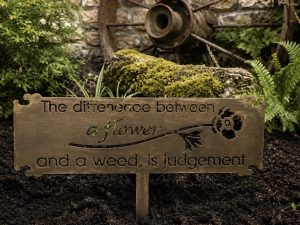 The Difference Between Flowers and Weeds is Judgement metal garden sign