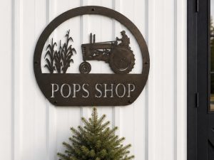 Metal FARM sign with corn stalks and old JOHN DEERE tractor
